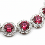 Close-up macro of ruby round stones and AD halo detail
