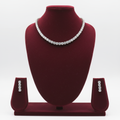 White AD round brilliant graduated tennis necklace set with stud earrings on burgundy velvet display