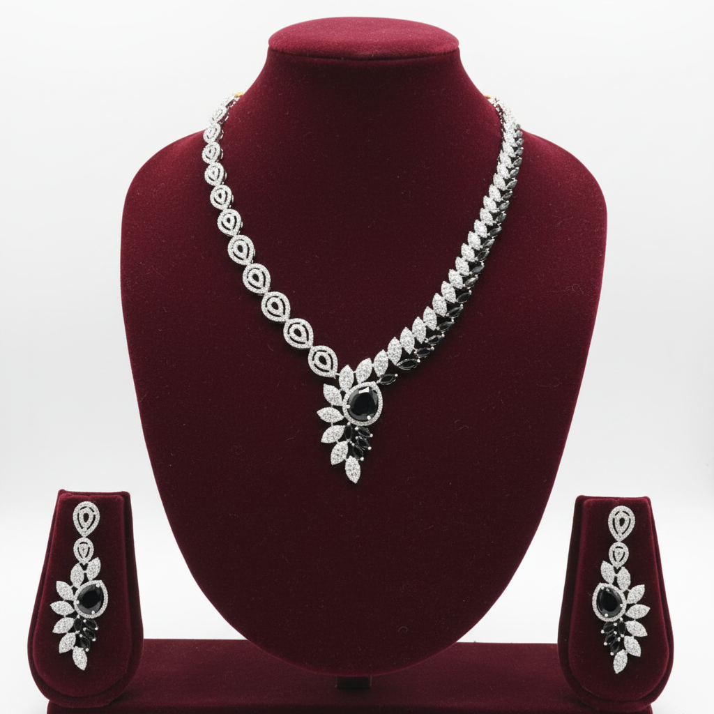 Black onyx leaf AD necklace set on burgundy velvet display