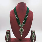 Emerald bead and pearl polki AD jade pendant long necklace set on burgundy velvet display
