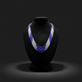 5-strand blue and white seed bead necklace on dark velvet studio display