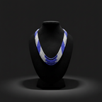 5-strand blue and white seed bead necklace on dark velvet studio display