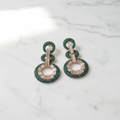 Emerald Green Fan Baguette CZ Double Circle Earrings – luxury flat lay on marble