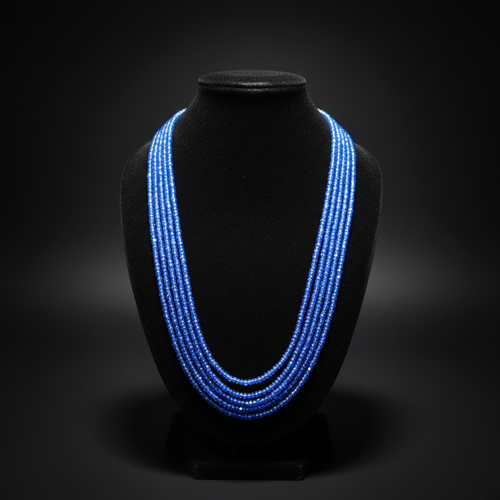 5-strand royal blue crystal bead necklace on dark velvet studio display