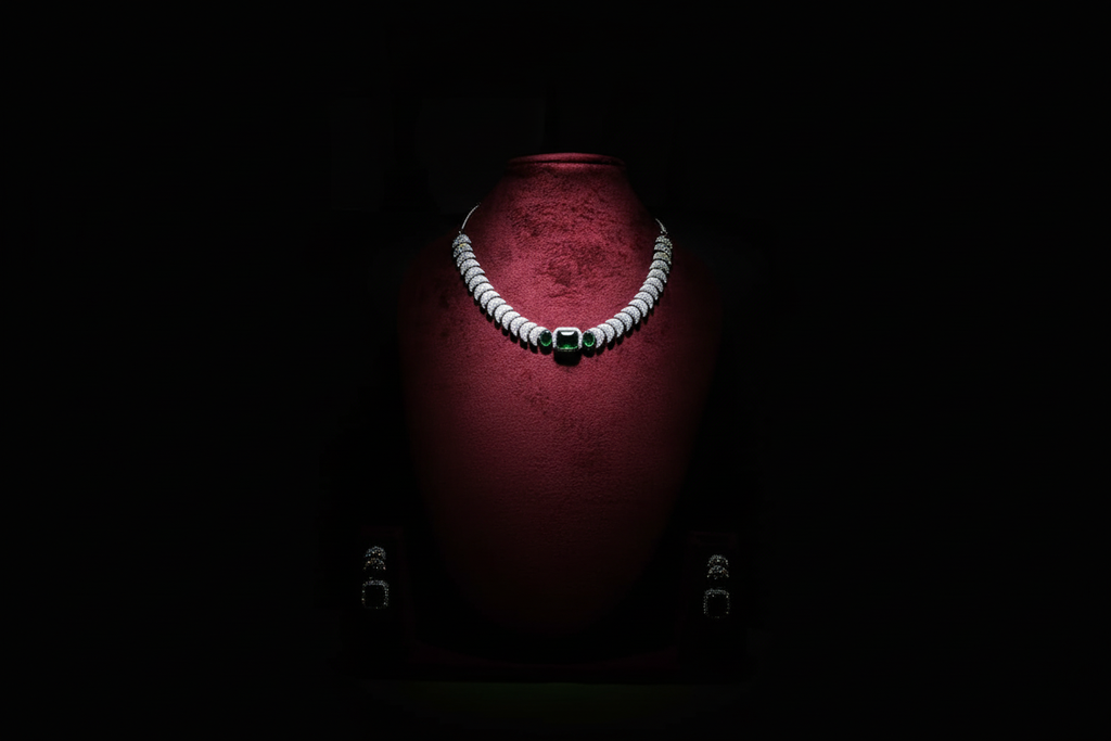 Emerald triple-stone AD pave disc necklace set promotional banner on black background