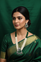 Bridal lifestyle — model wearing pearl and emerald bead AD peacock pendant long necklace set