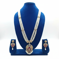 Pearl and ruby AD medallion long necklace set on navy velvet display