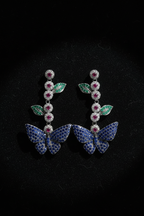 Blue Butterfly Garden Drop Earrings – dark velvet luxury editorial promotional image