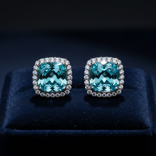 Aqua blue CZ cushion square halo stud earrings on dark navy velvet - dramatic editorial style