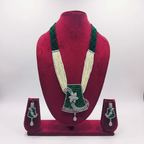 Emerald bead and pearl AD floral pendant long necklace set on burgundy velvet display