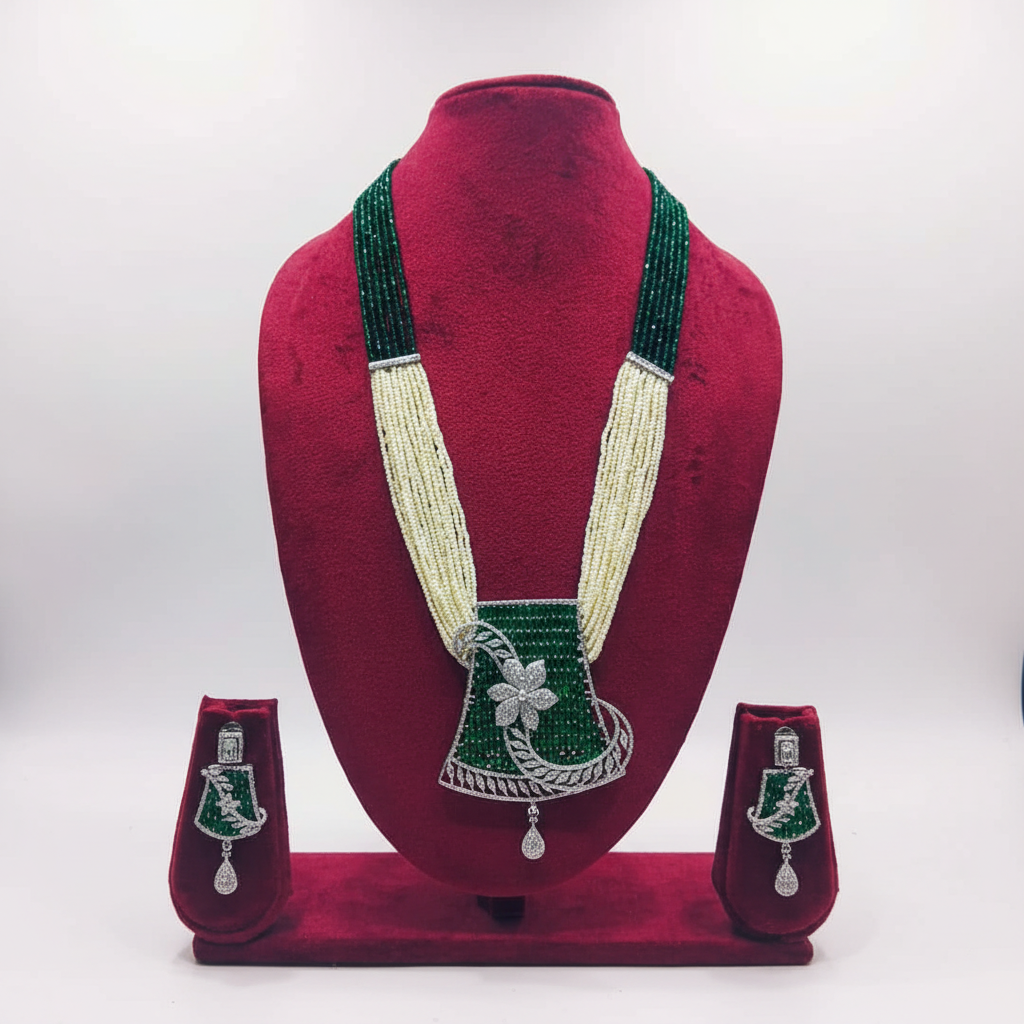 Emerald bead and pearl AD floral pendant long necklace set on burgundy velvet display