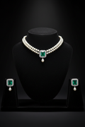 2-strand seed pearl choker with emerald square AD pendant on dark velvet studio display