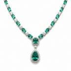 Close-up macro of emerald oval stones and double-drop pendant