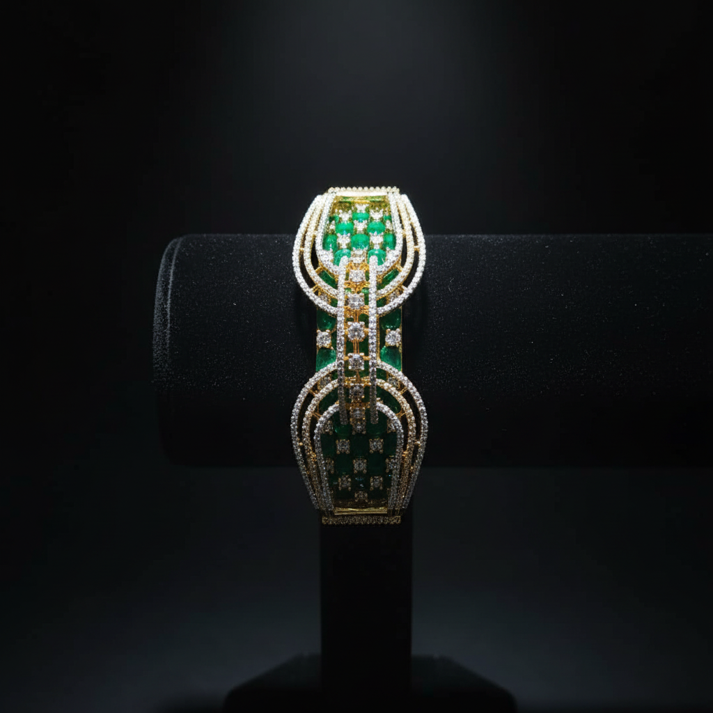 Emerald green open-work AD bangle with gold tone arch lattice design on dark velvet studio display