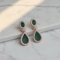 Emerald Green White CZ Double Teardrop Earrings – luxury flat lay on marble