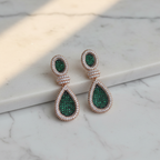 Emerald Green White CZ Double Teardrop Earrings – luxury flat lay on marble