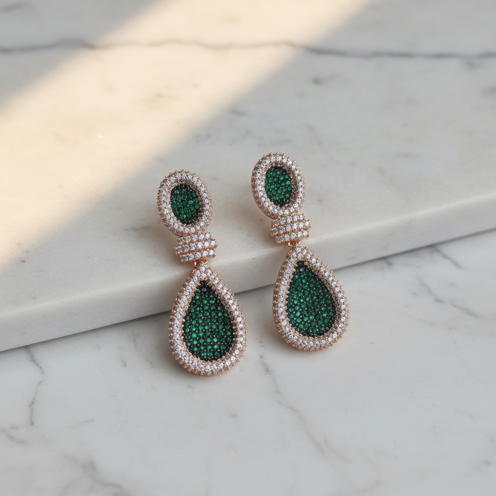 Emerald Green White CZ Double Teardrop Earrings – luxury flat lay on marble