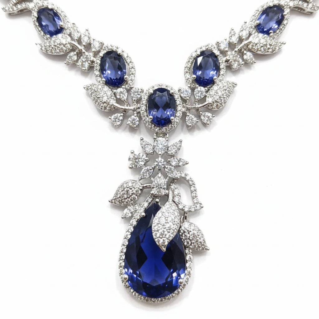 Close-up macro of floral AD pattern and sapphire teardrop pendant