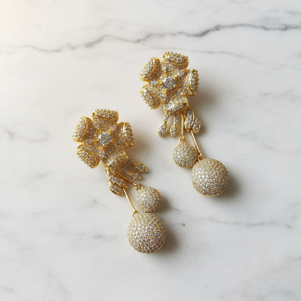 Luxury gold flower drop earrings editorial promotional image
