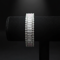 All-white baguette AD bangle with round polki AD border on dark velvet studio display