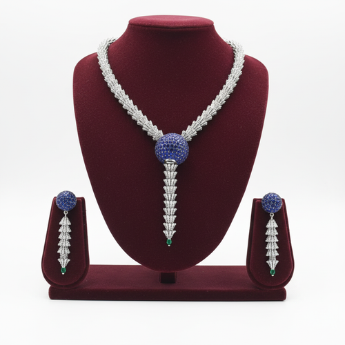 AD sapphire and emerald spiral shell necklace set on burgundy velvet display