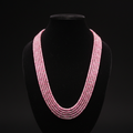 5-strand pink and silver seed bead necklace on dark velvet studio display