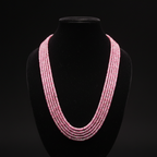 5-strand pink and silver seed bead necklace on dark velvet studio display