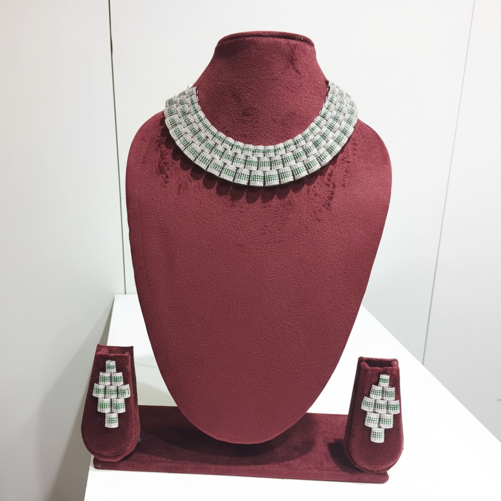 Emerald and diamond AD geometric grid bib choker set on burgundy velvet display