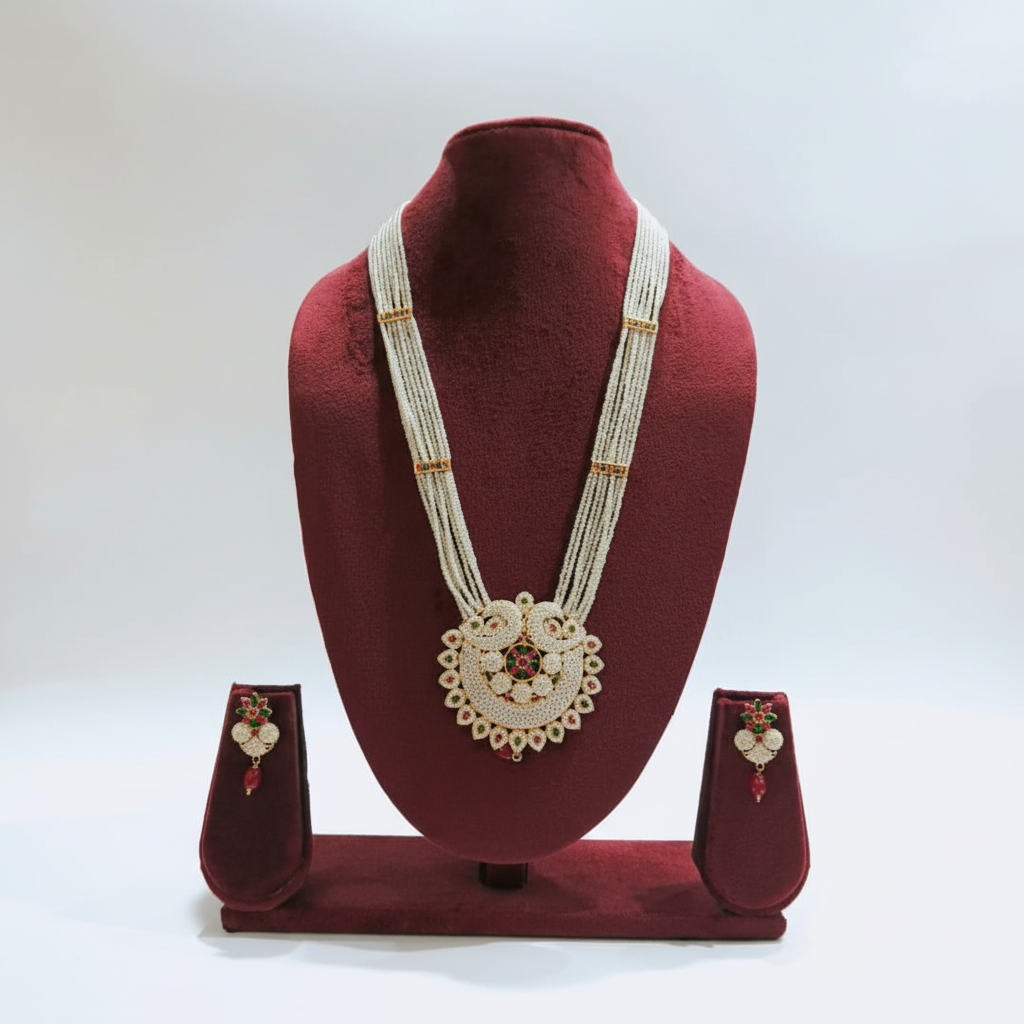 Pearl and AD kundan floral heart pendant long necklace set on burgundy velvet display