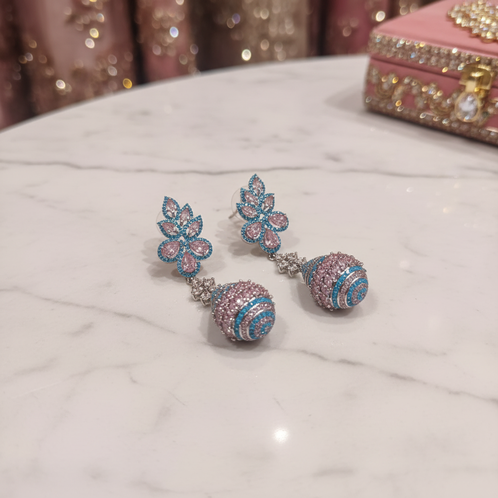Pink & Turquoise CZ Lotus Crown Earrings – luxury flat lay on marble