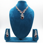 White AD and garnet red floral leaf pendant necklace set on teal velvet display