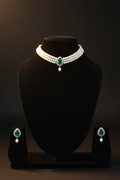 2-strand seed pearl choker with emerald teardrop AD pendant on dark velvet studio display
