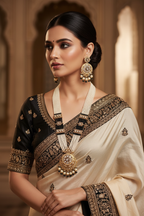 Bridal lifestyle — model wearing black bead and pearl AD chandbali pendant long necklace set