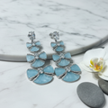 Silver CZ Triple Bow Drop Earrings – luxury flat lay on marble