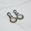 Emerald Green CZ Double Circle Earrings – luxury flat lay on marble