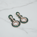 Emerald Green CZ Double Circle Earrings – luxury flat lay on marble