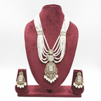 Multi-strand pearl waterfall and polki AD shield pendant long necklace set on burgundy velvet display