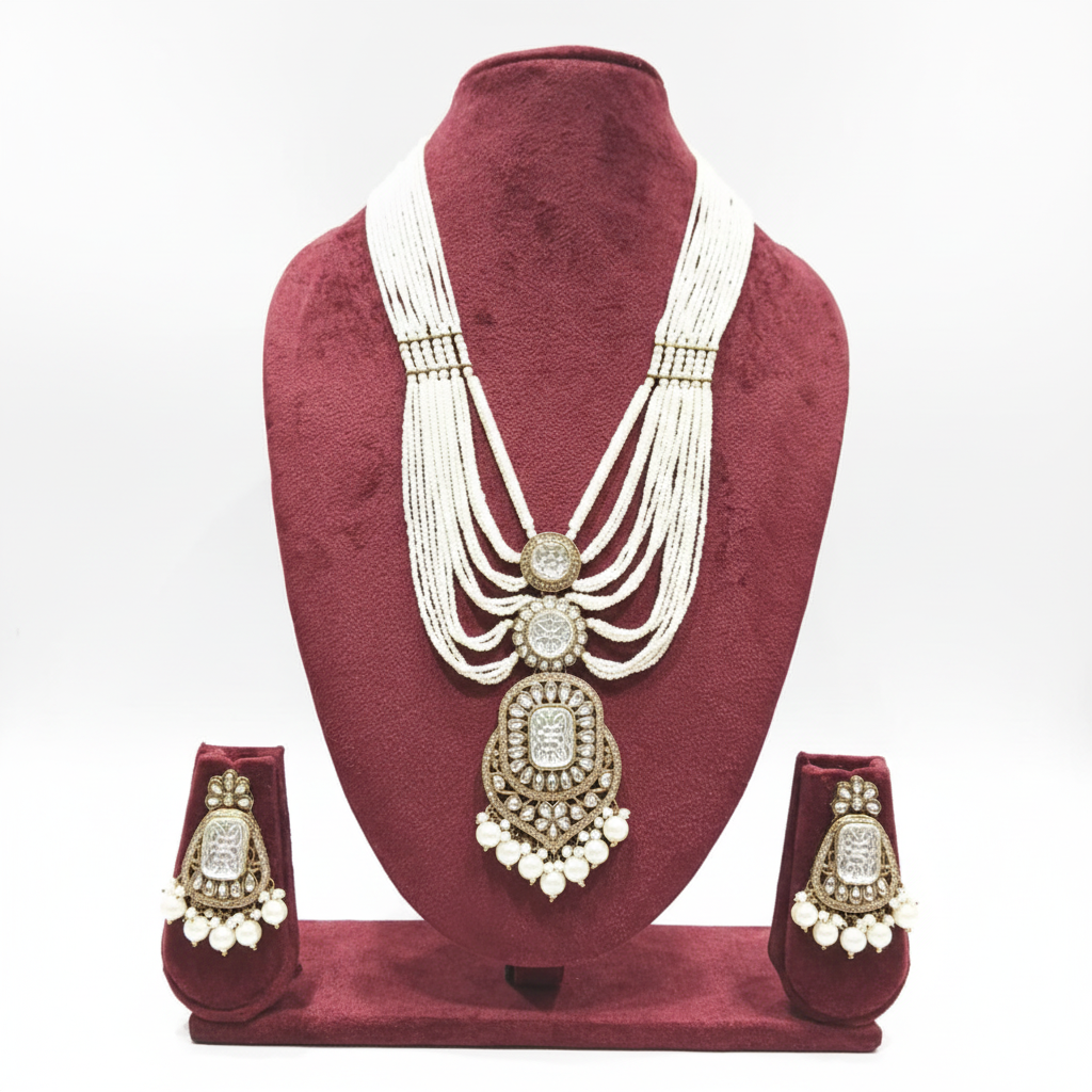 Multi-strand pearl waterfall and polki AD shield pendant long necklace set on burgundy velvet display