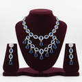 Sapphire blue AD double-row fringe necklace set on burgundy velvet display