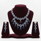 Sapphire blue AD double-row fringe necklace set on burgundy velvet display