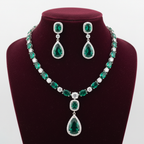 Emerald AD tennis necklace set on burgundy velvet display