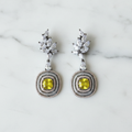 Yellow citrine leaf drop earrings editorial promotional image on marble