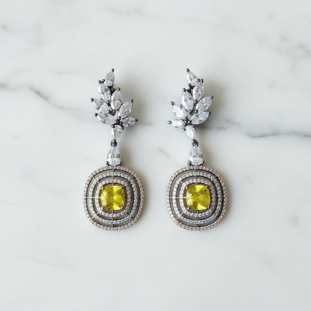 Yellow citrine leaf drop earrings editorial promotional image on marble