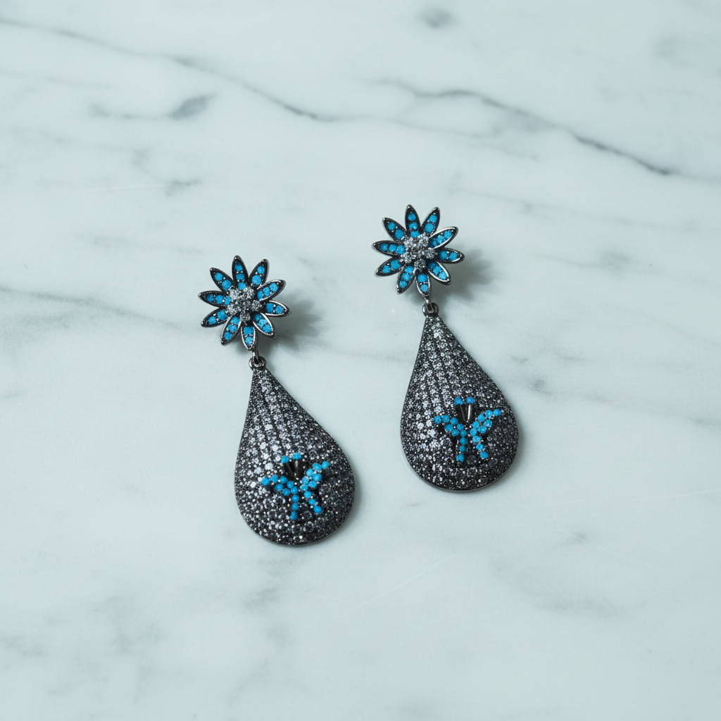 Turquoise Daisy & Black CZ Teardrop Earrings – luxury flat lay on marble