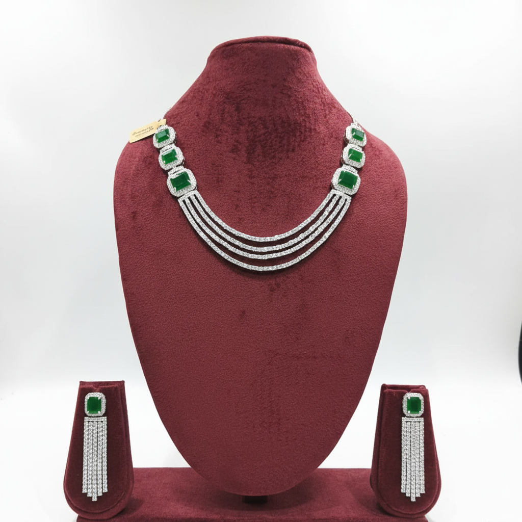 Emerald multi-strand AD necklace set on burgundy velvet display