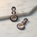 Navy Blue CZ Figure-8 Infinity Earrings – luxury flat lay on marble