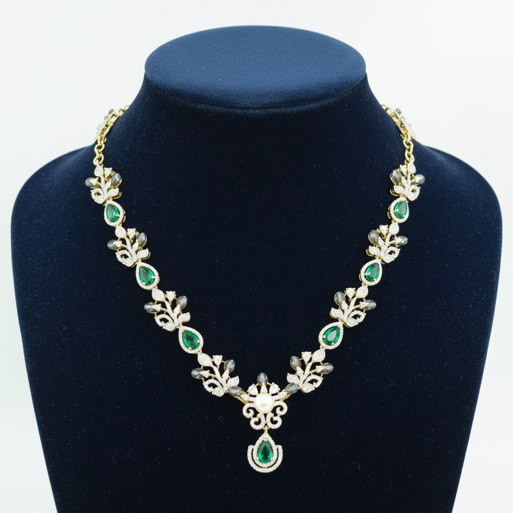 Emerald green and white AD botanical leaf necklace with pearl and emerald pendant on navy velvet display