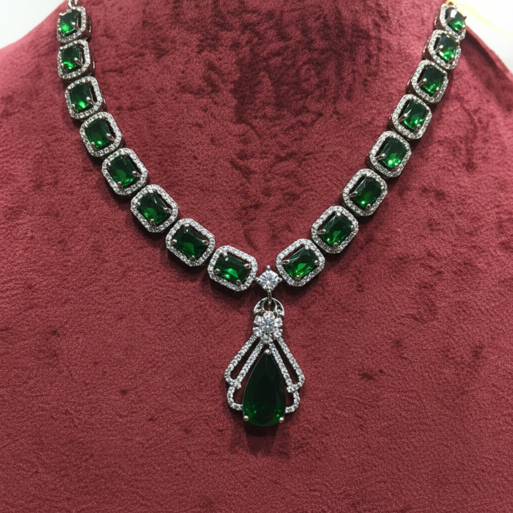 Close-up macro of emerald cushion-cut stones and AD halo