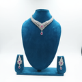 Ruby AD V-necklace set on teal velvet display