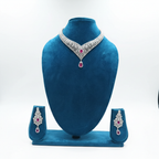 Ruby AD V-necklace set on teal velvet display